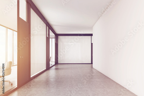 Empty office corridor with a meeting room  toned