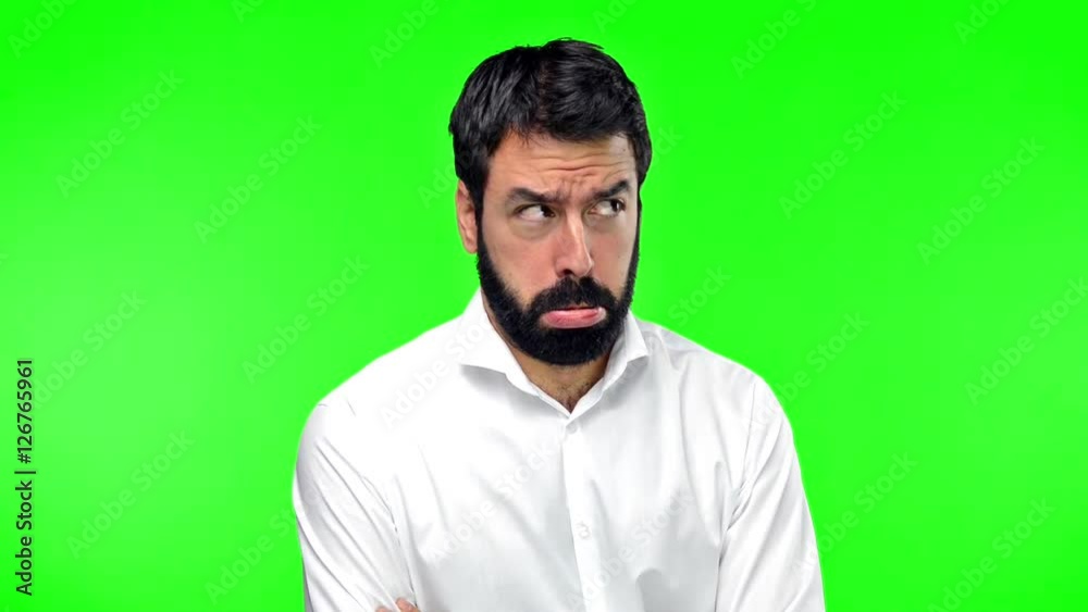 Sad handsome man on green screen chroma key Sad handsome man on green screen chroma key