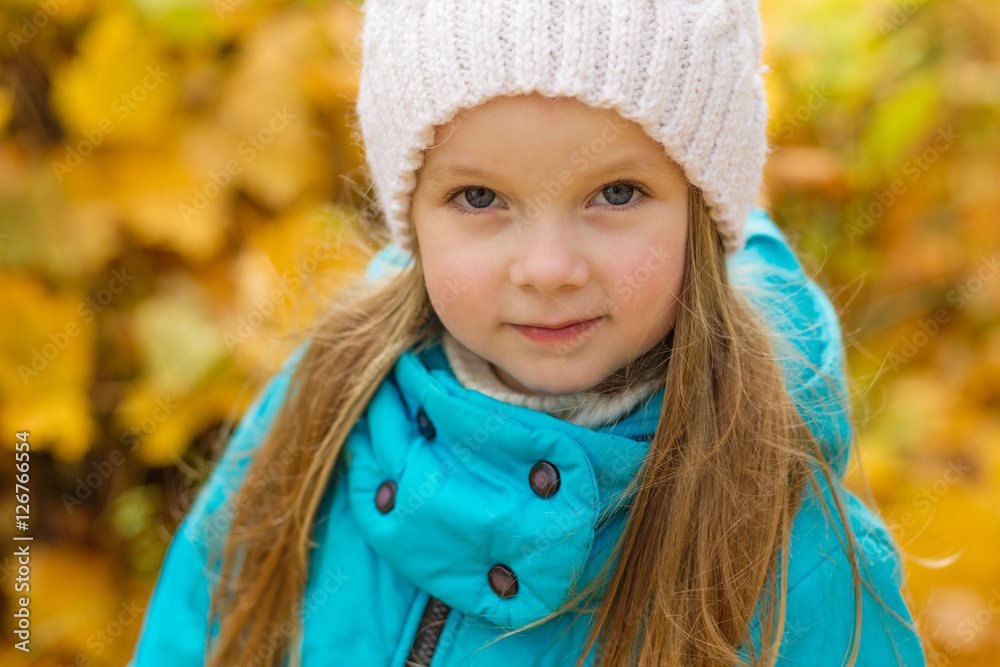 Portrait of a beautiful girl in a blue coat outdoors in autumn Portrait of a beautiful girl in a blue coat outdoors in autumn