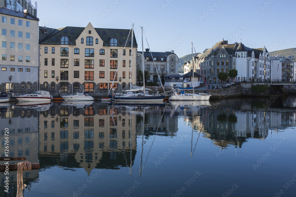 Alesund houses reflect in water