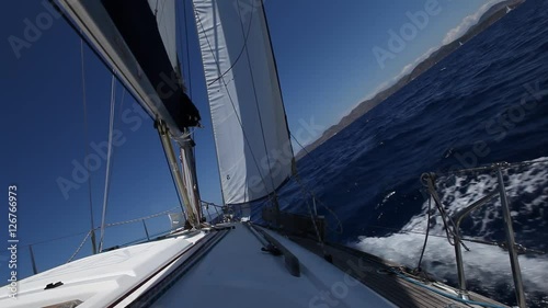 Sailing ship yachts with white sails in the Sea. Luxury boats.