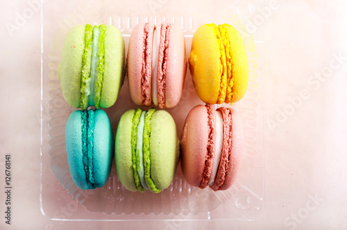 Macarons of different color in a box,
