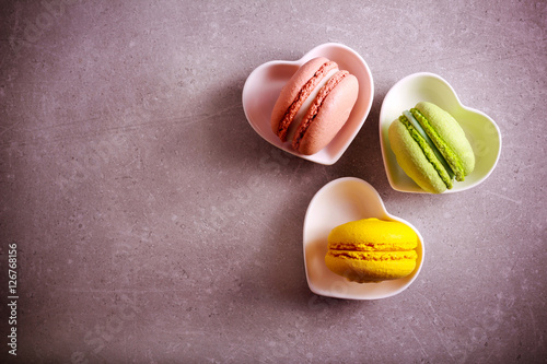 Macarons of different color in a heart shape