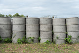 Concrete septic tanks  stacked outdoors.