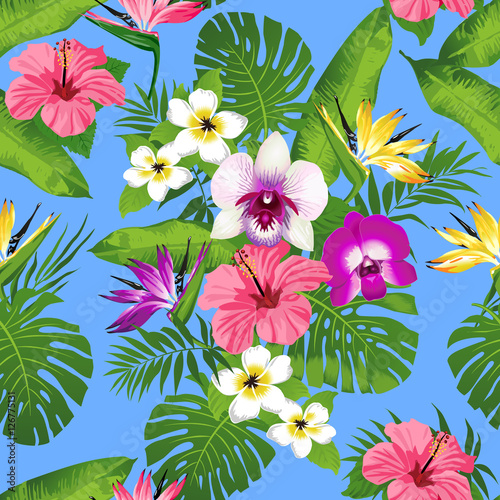 Tropical flowers and leaves on blue background. Seamless. Vector.