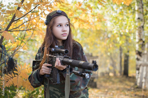 Wallpaper Mural Young girl with a gun is in the autumn forest Torontodigital.ca