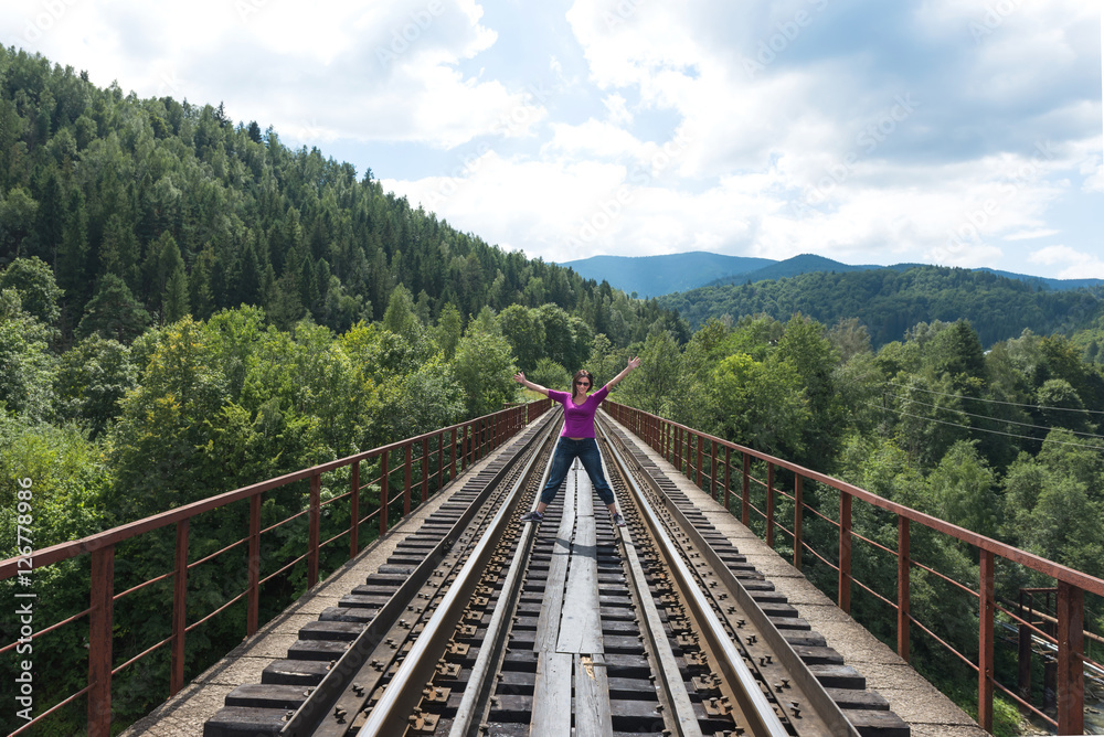 Fototapeta premium Woman and railroad. Ukraine. 