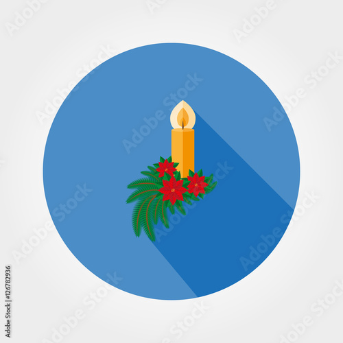 Christmas candle decorated with fir twigs and poinsettia