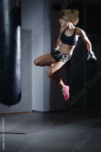 Girl training kick boxing