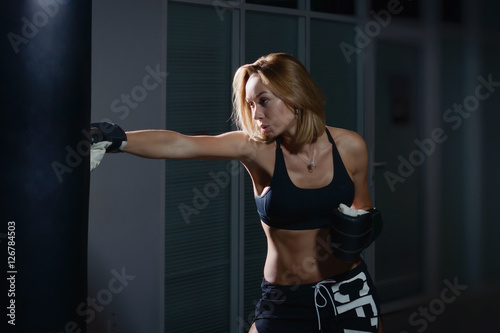 Girl training kick boxing