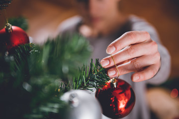 Woman decorating christmas tree
