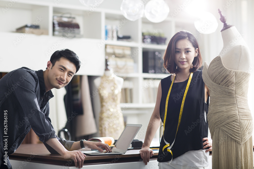 Portrait of two young fashion designers working in fashion boutique Portrait of two young fashion designers working in fashion boutique