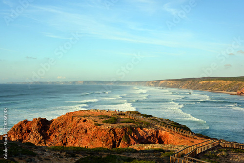 Coastline near Praia Da Bordeira beach at sunset, Portugal photo