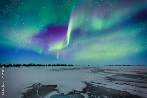 Aurora Borealis Over A Frozen Lake photo
