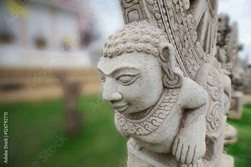 Stone statue imitating art of Asian ancient.