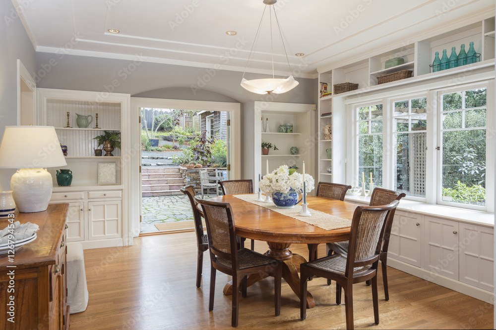 Dining room in luxury home with french doors - obrazy, fototapety, plakaty 