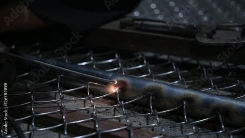 Welder works in the dark 