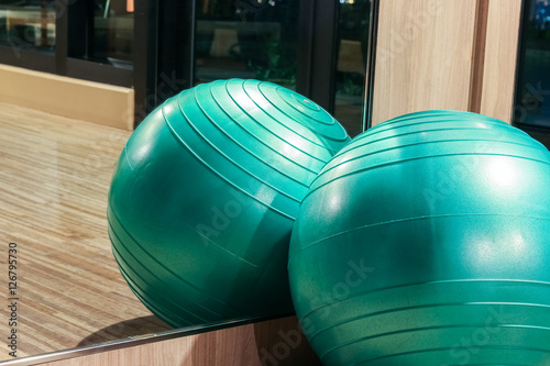 Yoga ball in fitness room with mirror reflection  fitness concept