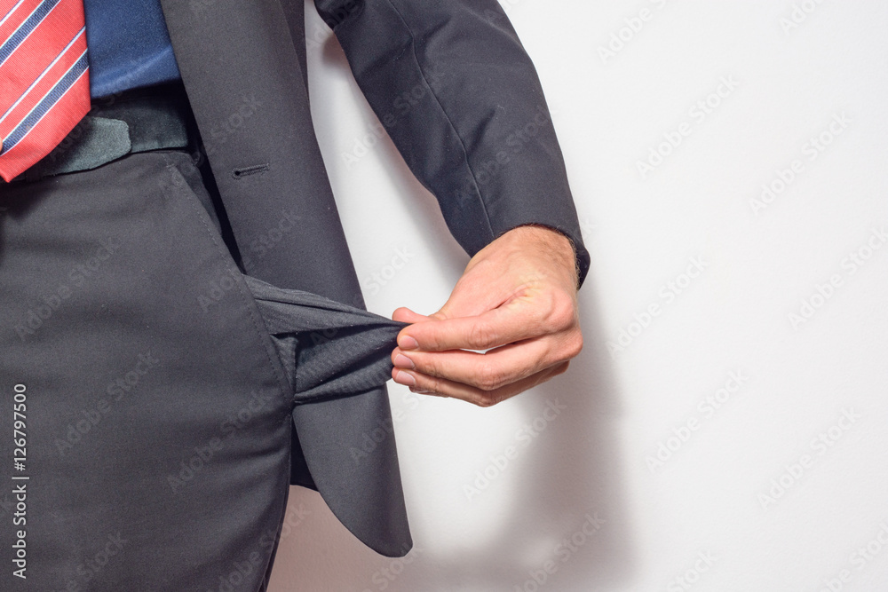Fototapeta premium A man holding his pocket out of his pants