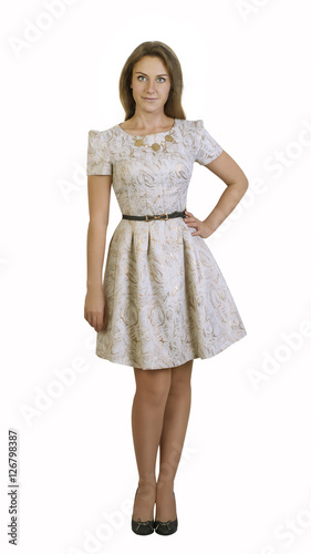 Obraz na płótnie Caucasian woman wearing brown dress standing on isolated background w salonie