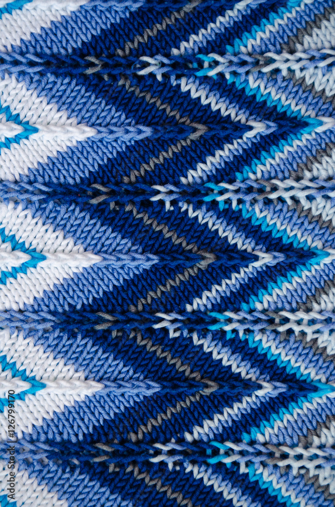 Knitted fabric in white and blue colors with a zigzag pattern Knitted fabric in white and blue colors with a zigzag pattern