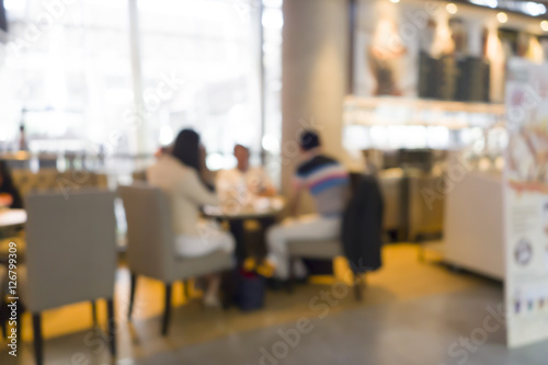 blur image of shopping mall and people with abstract bokeh