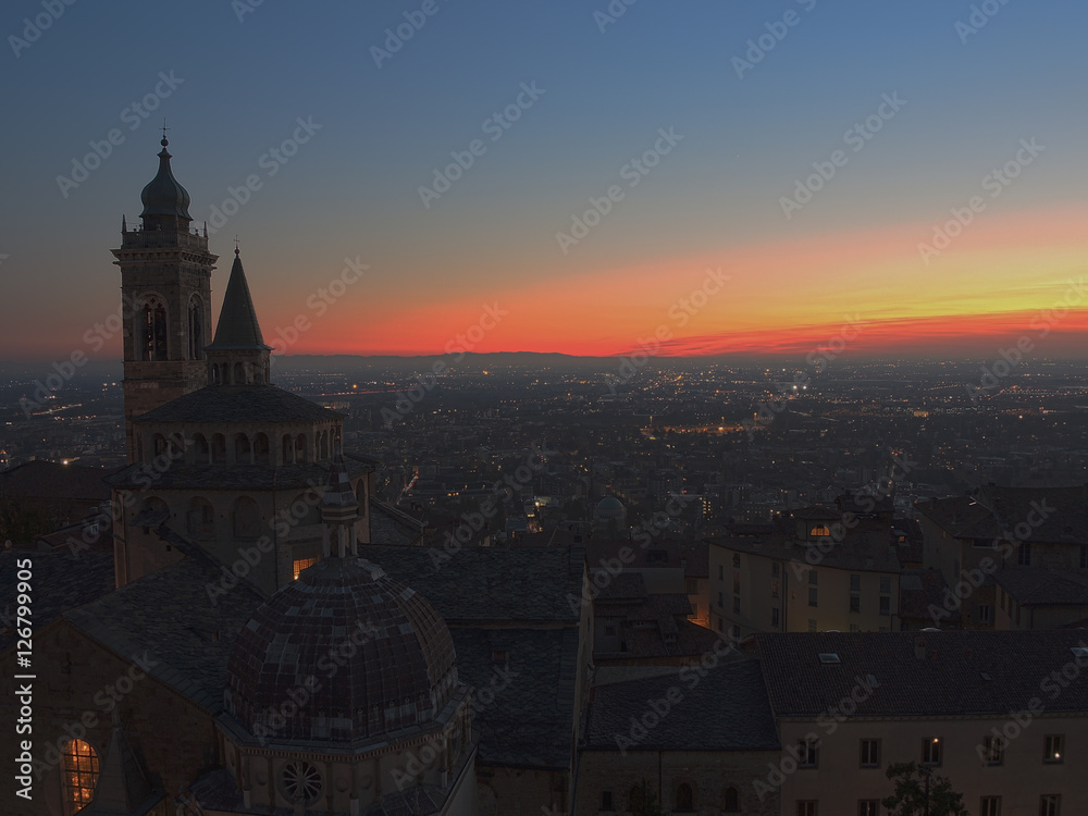 Bergamo - Old city (Citta Alta). One of the beautiful city in Italy. Lombardia. Evening sunset. Landscape on the old city, Cathedral, clock towers and the Po Valley.        
