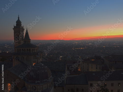 Bergamo - Old city  Citta Alta . One of the beautiful city in Italy. Lombardia. Evening sunset. Landscape on the old city  Cathedral  clock towers and the Po Valley.        