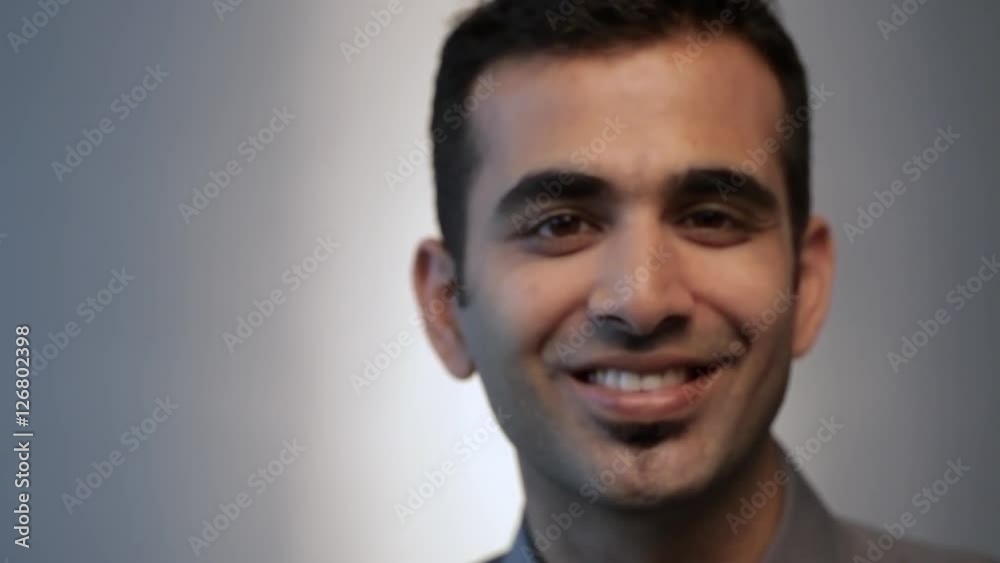 CU MS FOCUS Portrait young man smiling, studio shot CU MS FOCUS Portrait young man smiling, studio shot