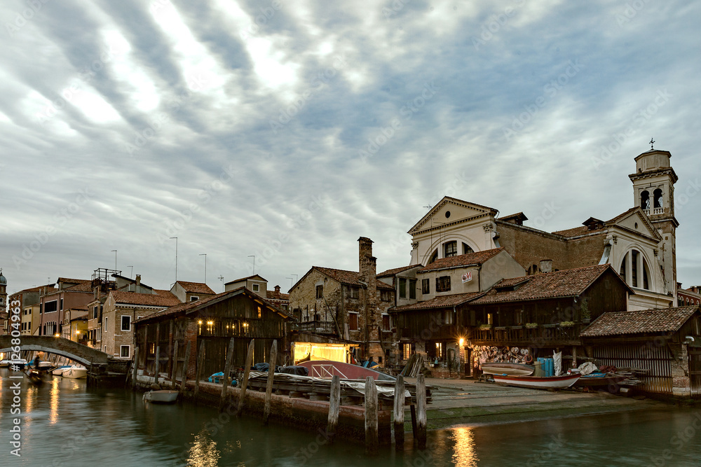 San Trovaso, Venice - church and boatyard with dramatic sky in the evening