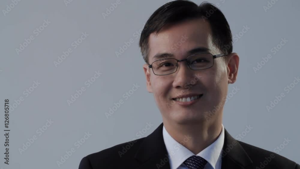 CU TU Businessman holding folder and looking at camera CU TU Businessman holding folder and looking at camera