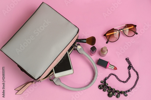 Woman handbag with makeup and accessories photo