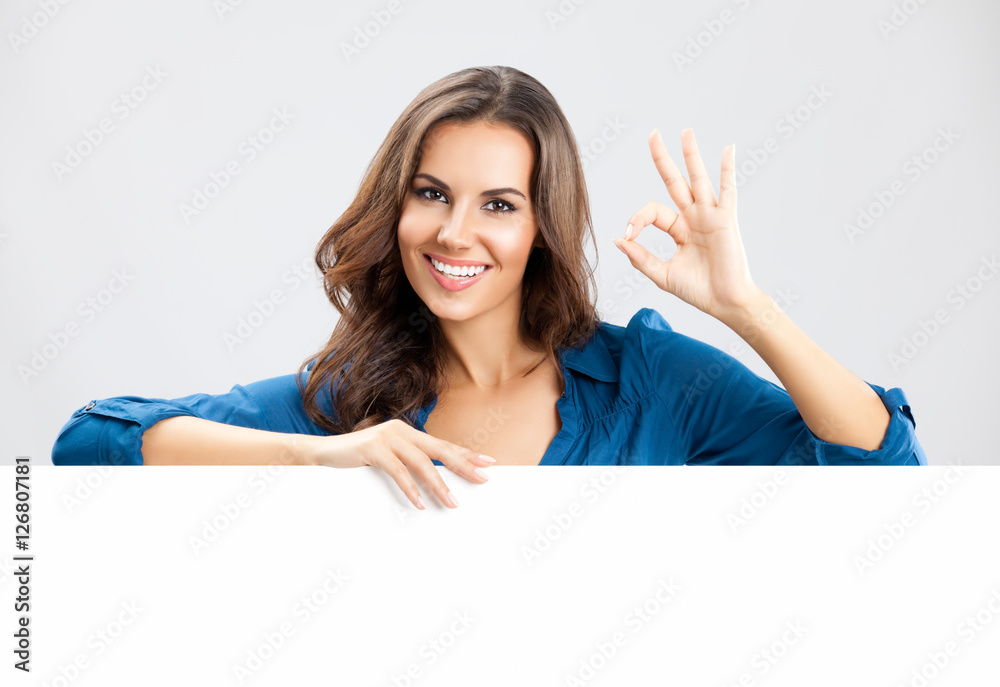 Young woman showing blank signboard Young woman showing blank signboard