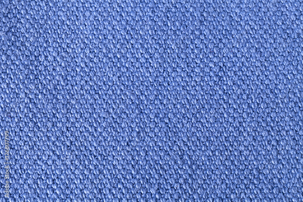 Blue background of fabric, one color, texture of the material Blue background of fabric, one color, texture of the material