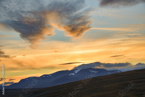 Bright yellow sunset over the highest swedish mountains in Sarek © Wouter