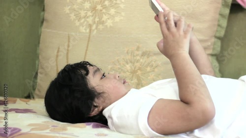 Asian girls playing a game on smart phone