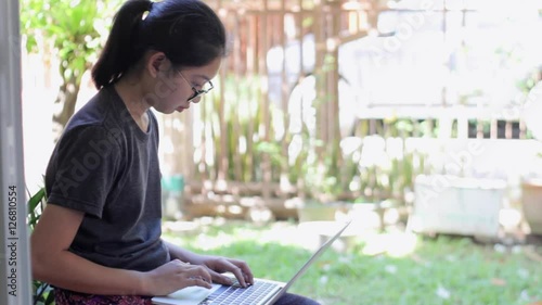 Beautiful girl relaxing on sofa using laptop