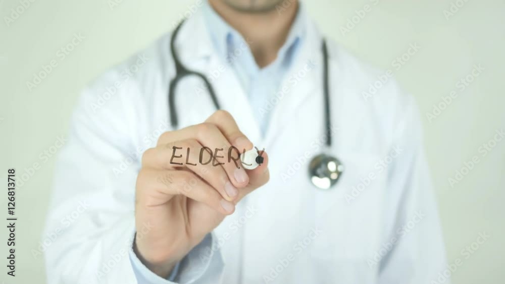 Elderly Care , Doctor Writing On Transparent Screen Elderly Care , Doctor Writing On Transparent Screen