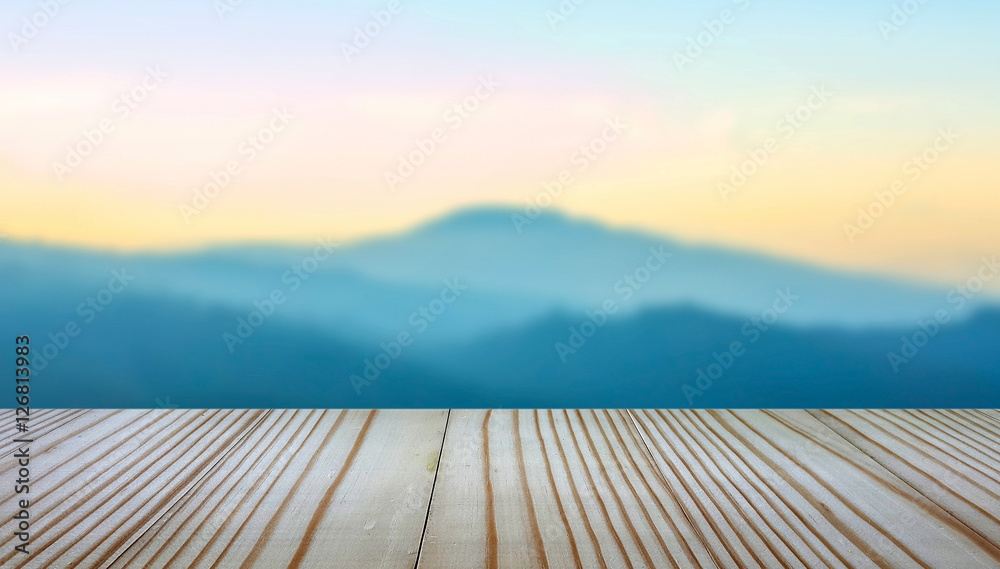 wooden balcony on landscape sunset background.