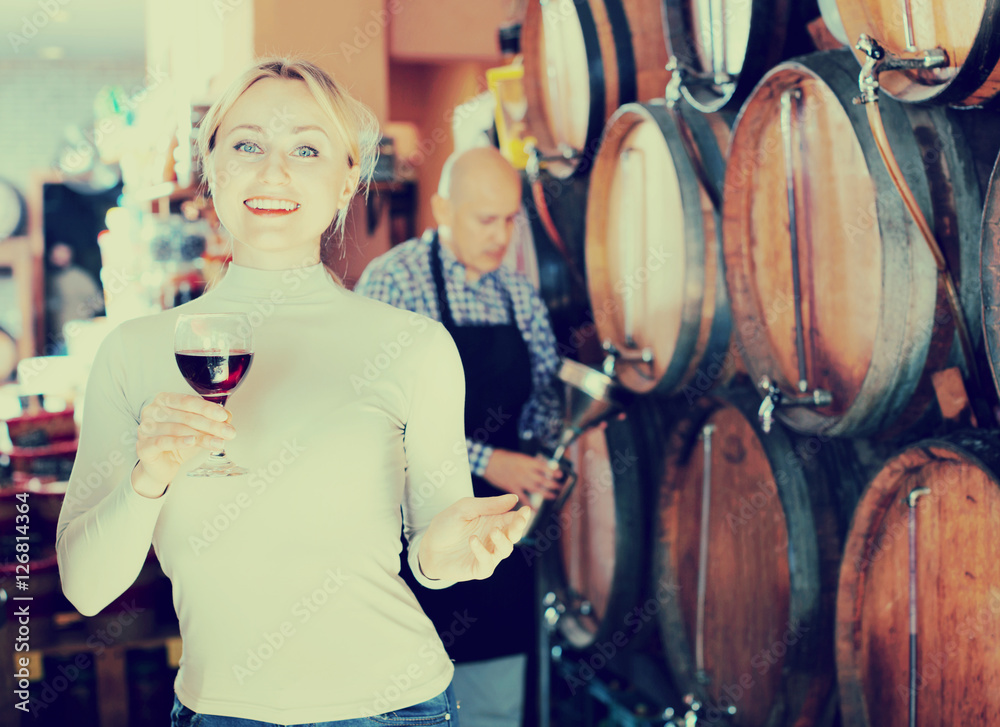 Portrait of  female  holding wine glass in winery