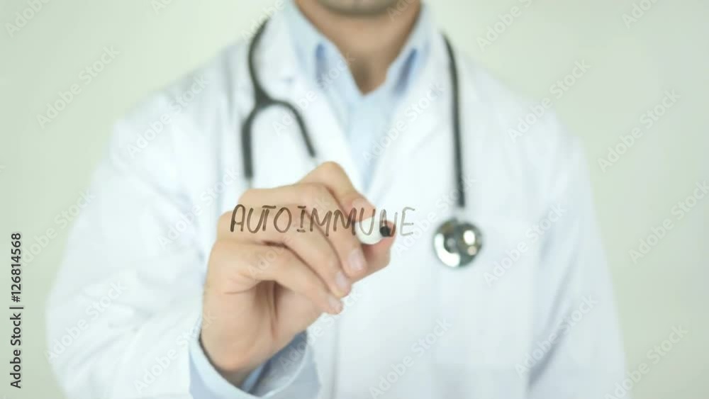 Autoimmune disease , Doctor Writing On Transparent Screen Autoimmune disease , Doctor Writing On Transparent Screen