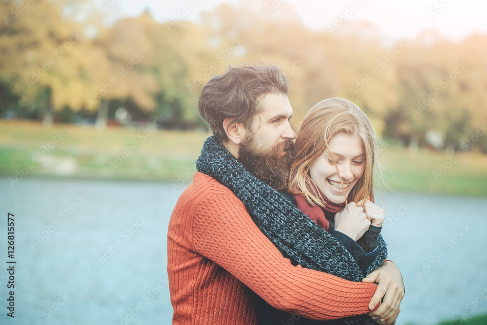 Fototapeta premium Young couple in autumn park