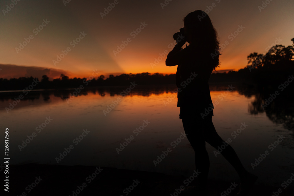 Photographer at sunset