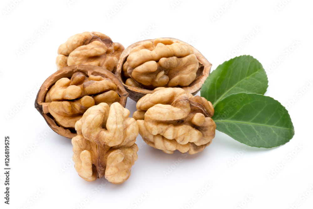 Walnut and walnut kernel isolated on the white background. Walnut and walnut kernel isolated on the white background.