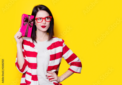 woman in glasses with gift box