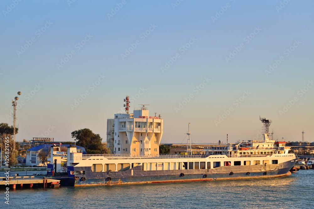 The ferry moored in the port of Kavkaz in the sunset