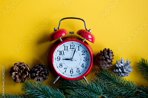 Christmas alarm clock and pine branch