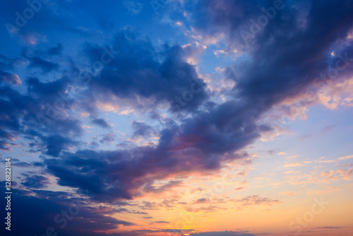 Fototapeta Naklejka Na Ścianę i Meble -  Sunset with clouds, light rays and other atmospheric effect