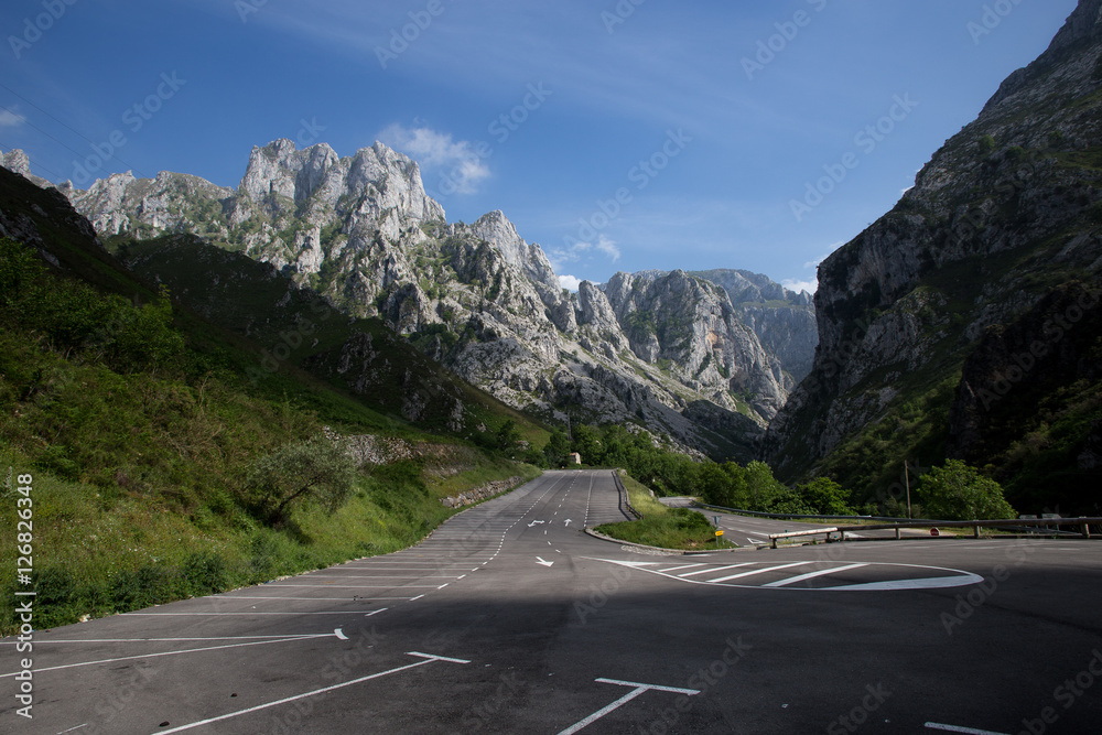 Mountain landscate in spain with empty parking are in foreground.