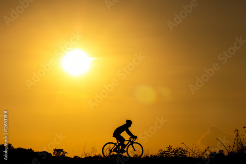 Silhouette of cyclist in motion